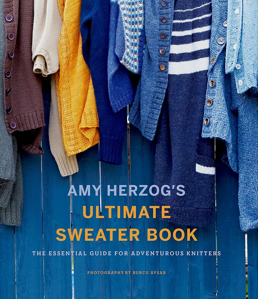 Image of "Ultimate Sweater Book" - a beautiful display of sweaters hung over a blue fence.  A full-color comprehensive guide to knitting sweaters and designing and modifying sweater patterns, by Amy Herzog, the author of You Can Knit That, Knit to Flatter, and Knit Wear Love.